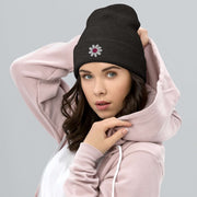 Our gender-neutral beanie is not only super cozy and comfortable to wear, but it also features an embroidered happy face daisy that will make you smile every time you put it on. 
