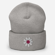 Our gender-neutral beanie is not only super cozy and comfortable to wear, but it also features an embroidered happy face daisy that will make you smile every time you put it on. 
