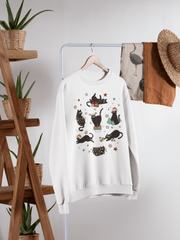Introducing the purrfect cozy sweater for the festive season- our gender neutral black cat sweatshirt! This sweatshirt is sure to bring a smile to your face with its adorable design featuring black cats doing funny Christmas things.