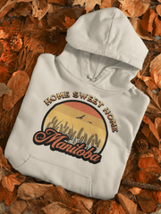 Introducing the perfect Nature Shirt for those who love a good Sunset! Our gender-neutral hoodie features a stunning Prairie sunset with wheat and the sweet saying "Home Sweet Home Manitoba." Not only does it look great, but it's also ultra-comfortable and perfect for any season.