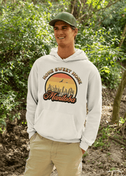 Introducing the perfect Nature Shirt for those who love a good Sunset! Our gender-neutral hoodie features a stunning Prairie sunset with wheat and the sweet saying "Home Sweet Home Manitoba." Not only does it look great, but it's also ultra-comfortable and perfect for any season. 
