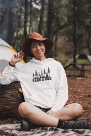 Introducing our gender-neutral hoodie featuring a stunning forest scene and the motivational slogan "Take A Hike". This cozy and stylish hoodie is perfect for any adventure seeker, whether hitting the trails for a day hike or embarking on a longer journey. 