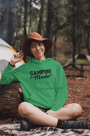 Introducing our gender-neutral hoodie, perfect for outdoor enthusiasts and camping lovers! Featuring a fun camping graphic on the back and the phrase "Camping Mode" on the front, this hoodie is both stylish and comfortable. 