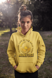 Harvest Hoodie with a beautiful graphic of a farmer's field, wheat, and a prairie sunset with the phrase Prairie Life Is The Best Life perfectly captures the essence of living in Manitoba.