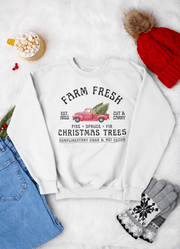 Introducing the perfect hoodie for the holiday season: our gender-neutral, ultra-cozy hoodie featuring a vintage farm truck loaded up with fresh Christmas trees.
